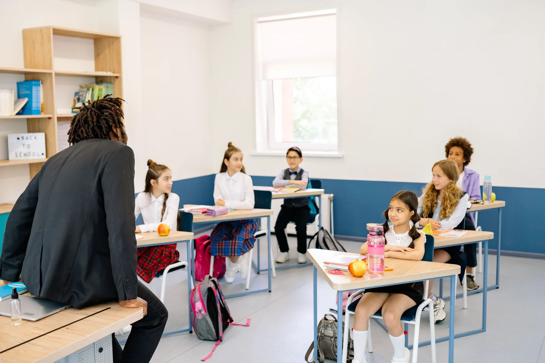 Teacher leading a diverse classroom