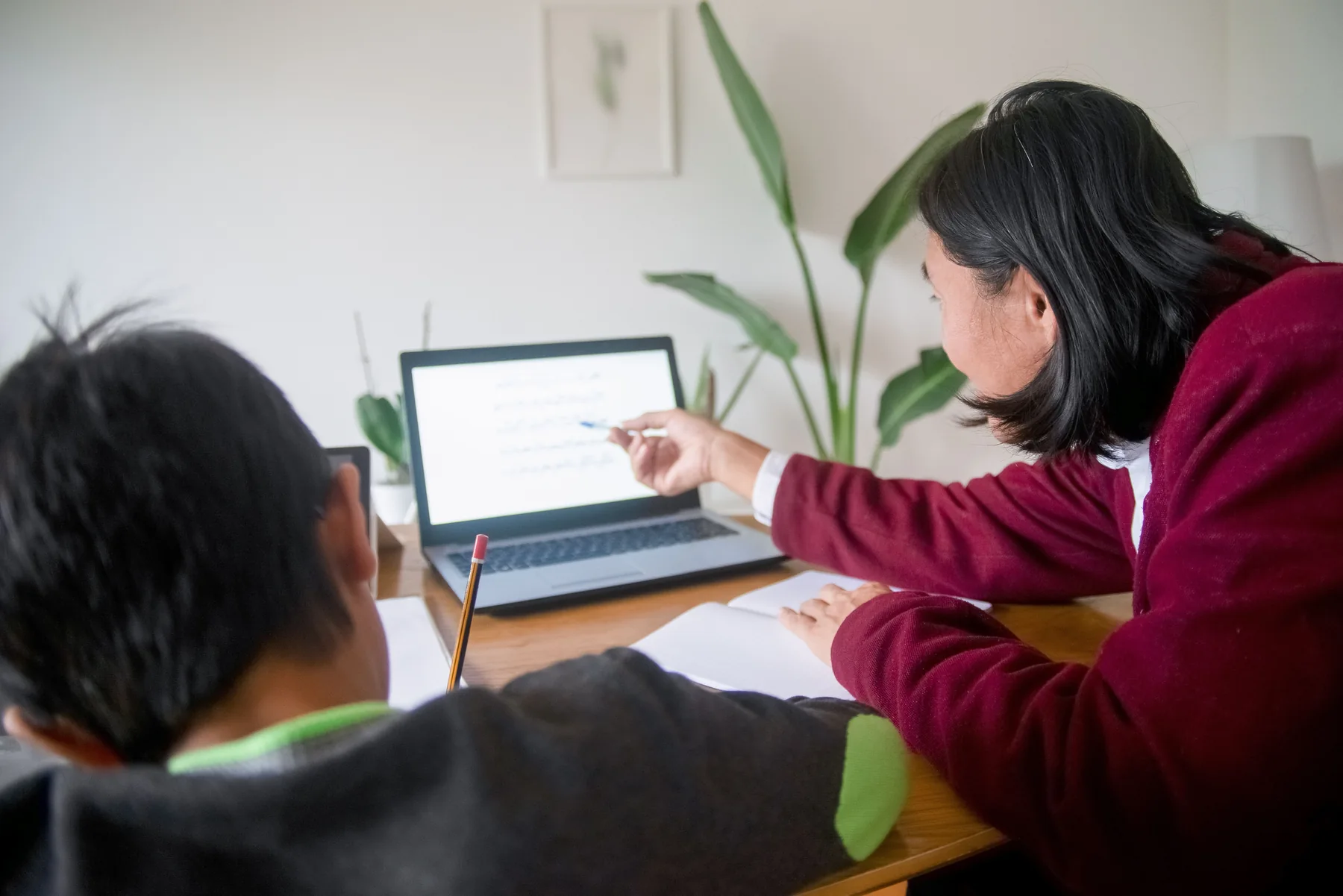 Parent supporting a child learning at home
